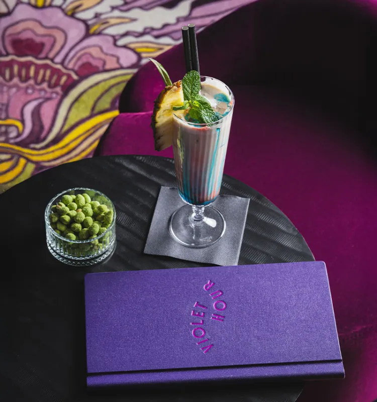 Drink and snack on black table at Grand Elisabeth Designhotel Bad Ischl