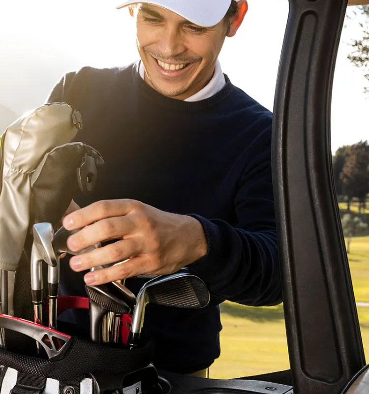 Guest of Grand Elisabeth hotel in Bad Ischl prepares for a round of golf during wellness holiday.