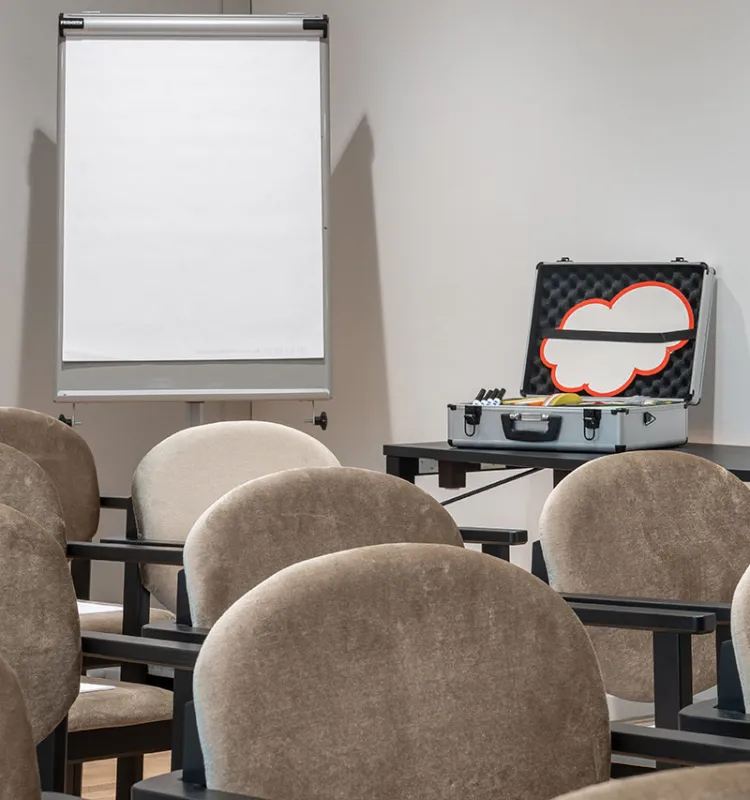 Workshop scene at the Grand Elisabeth design hotel with a focus on hands and laptops